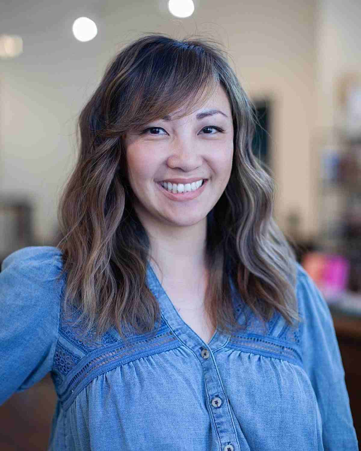 Medium Layered Wavy Hair with Side Bangs