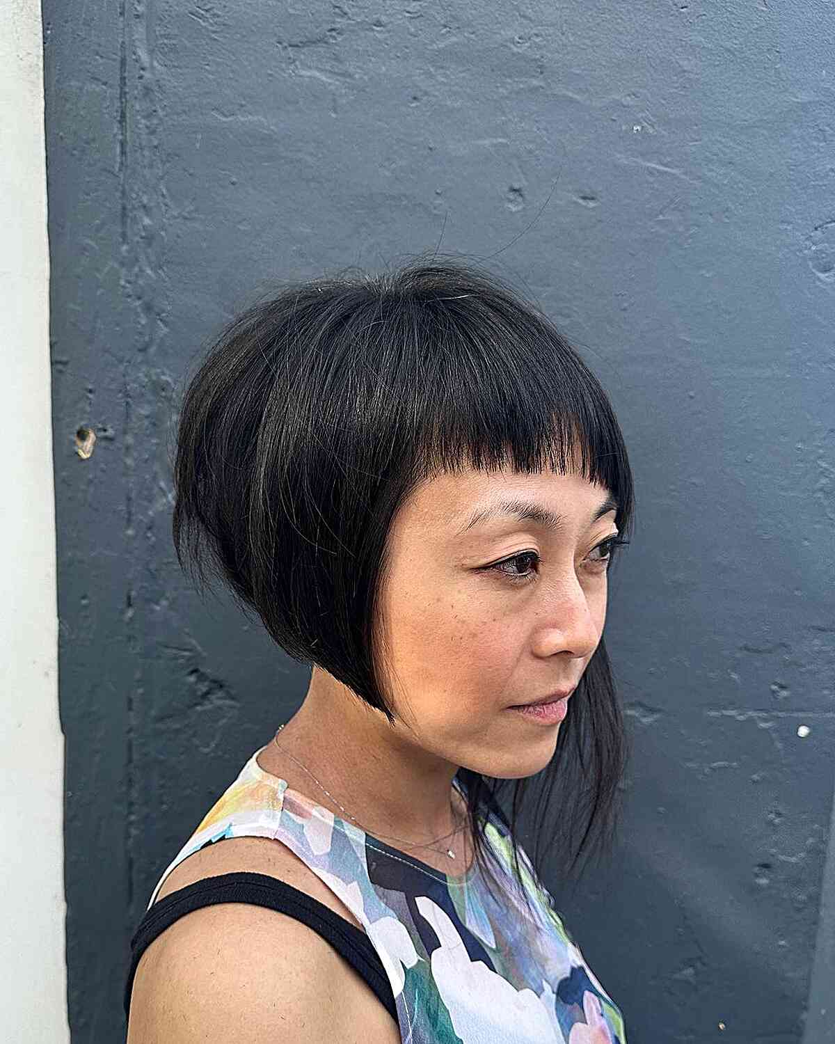 Short Textured Asymmetric Bob Style with Short Blunt Bangs