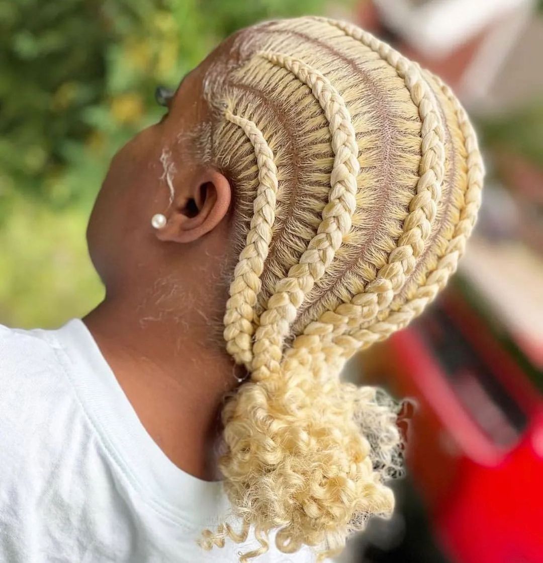 Blonde Cornrow Braids into a Low Curly Bun