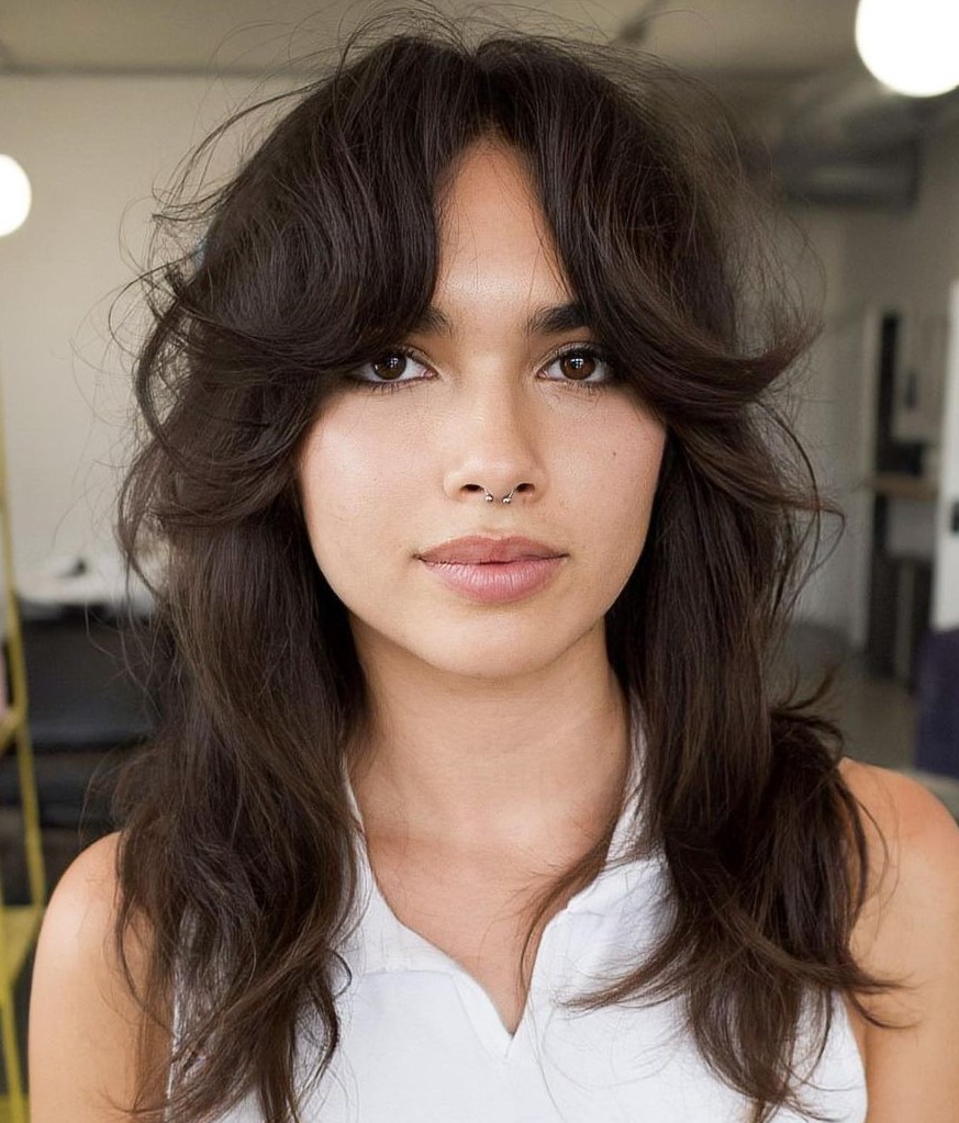 Medium Haircut with Layers and Curtain Bangs