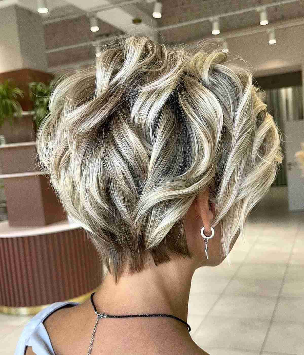 Feminine Textured Pixie with Blonde Highlights