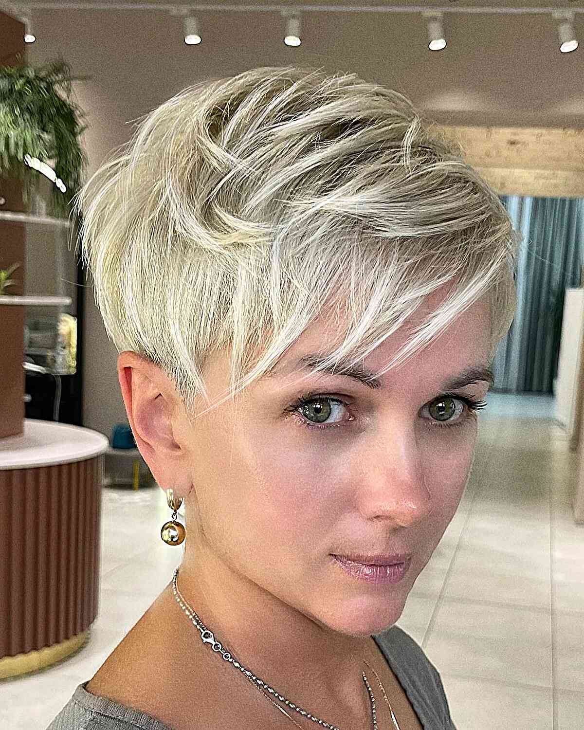 Champagne Blonde Pixie with Layers and bangs