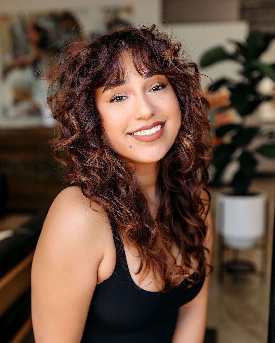 Red Brown Hairstyle with Curtain Bangs for Curly Hair