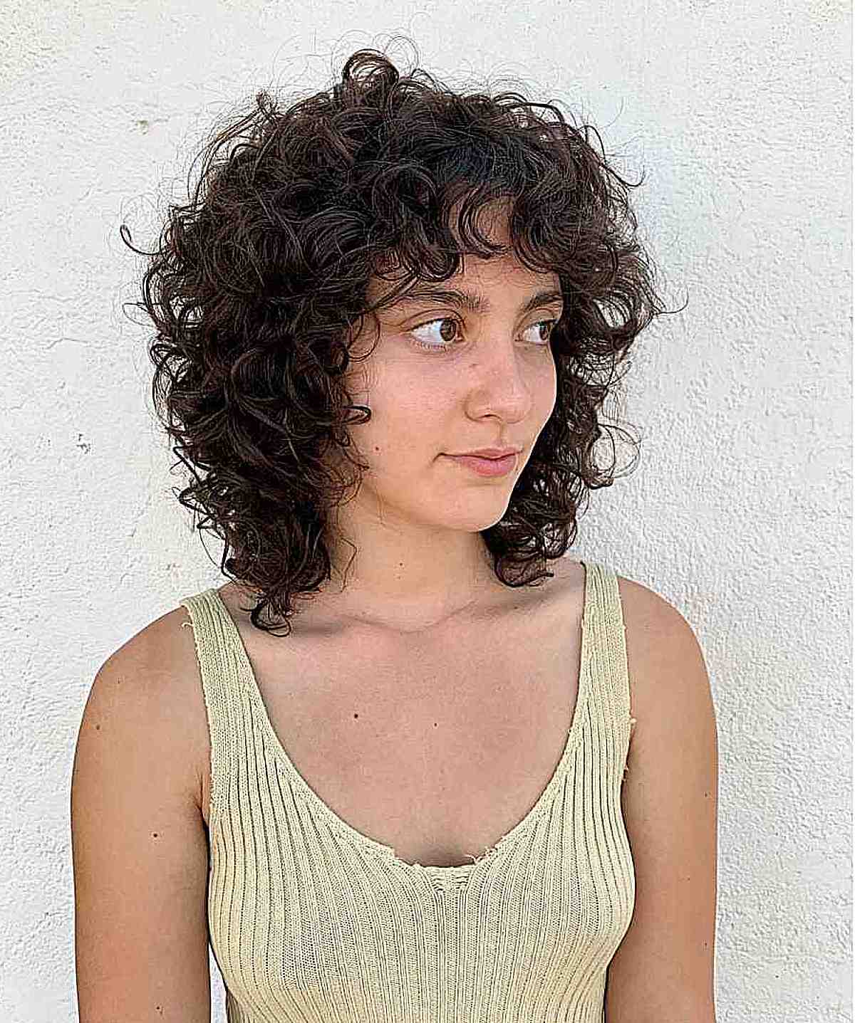 Shoulder-Grazing Shaggy Bob Cut with Textured Curls