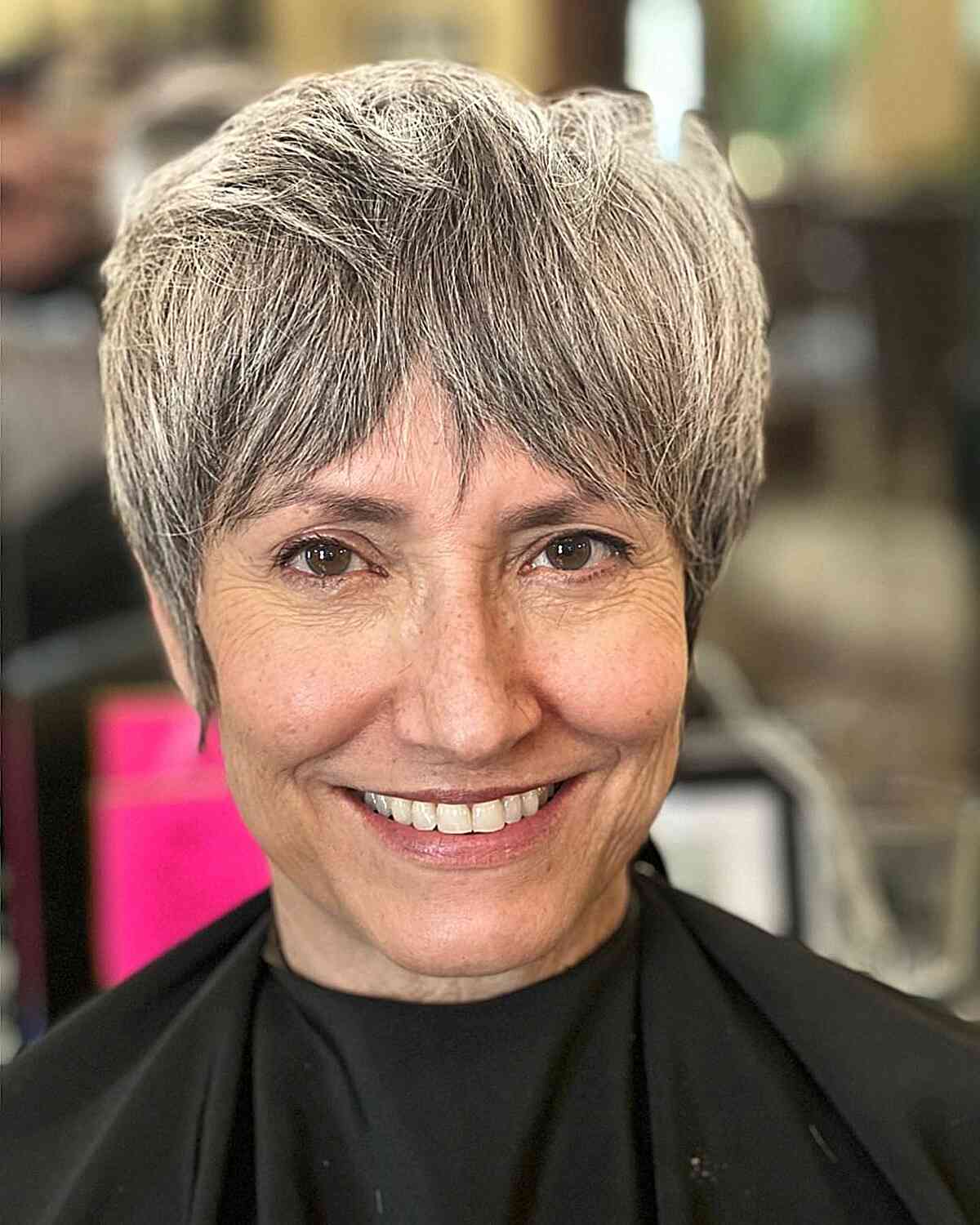 Trending Pixie Shag with Bottleneck Fringe on older ladies with natural salt and pepper hair