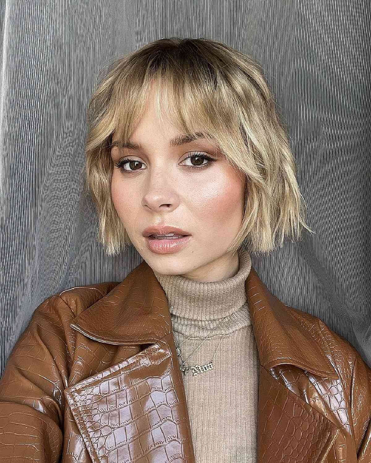 Short Blonde Bob with Soft Beach Waves and Wispy Fringe