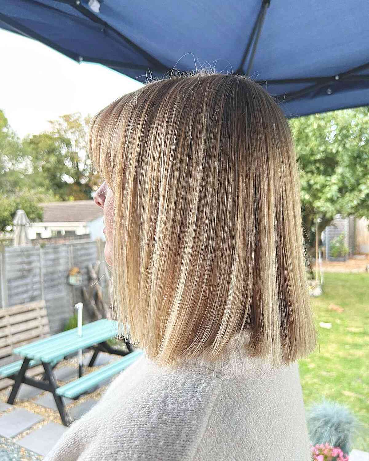 Shoulder-Length Blonde Box Bob with Fringe