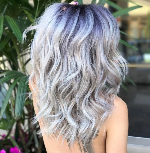 Ash Blonde Wavy Hairstyle With Blue Black Roots