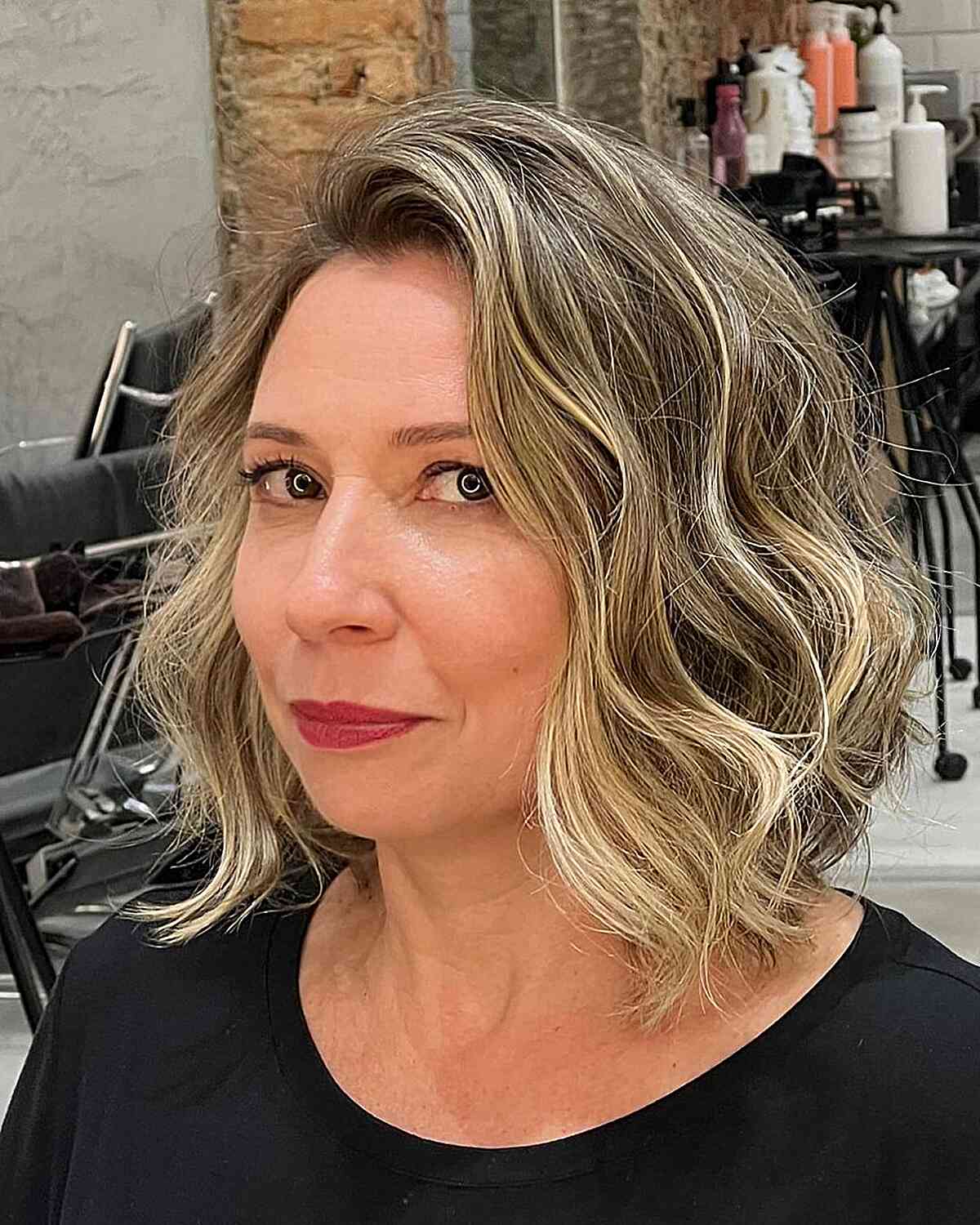 Shoulder-Length Textured Bob with Blonde Balayage with messy waves