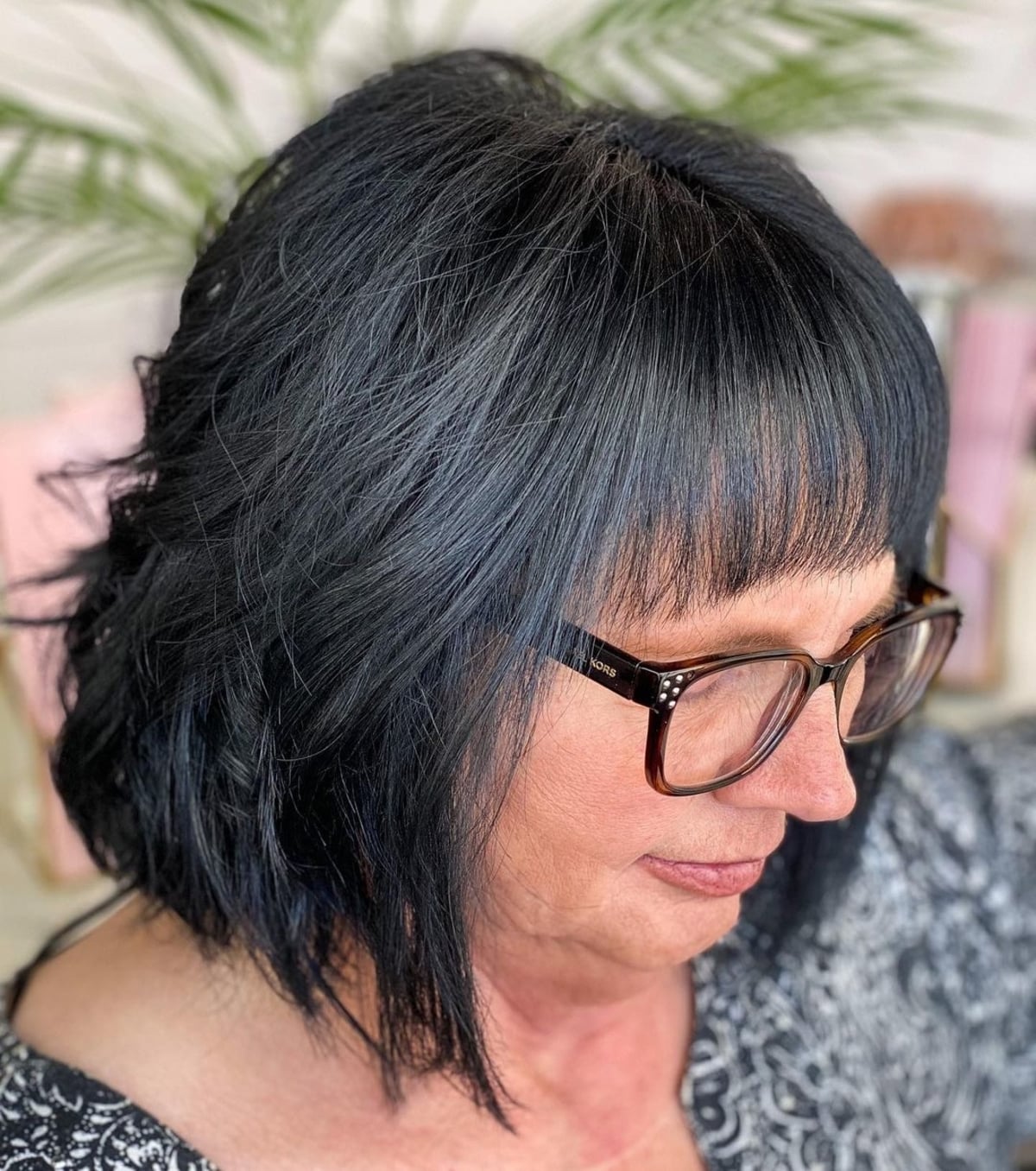 layered bob for 60-year-old women with glasses