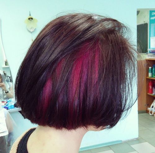 dark brown bob with magenta peekaboo highlights