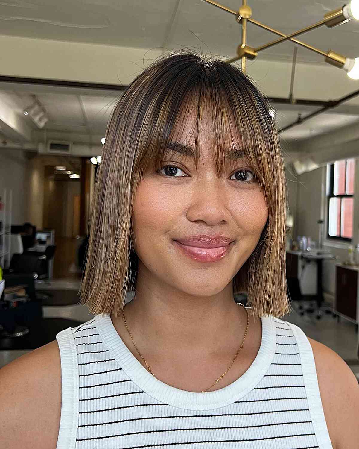 Neck-Length Playful Bob Cut with Long Wispy Fringe for straight hair textures