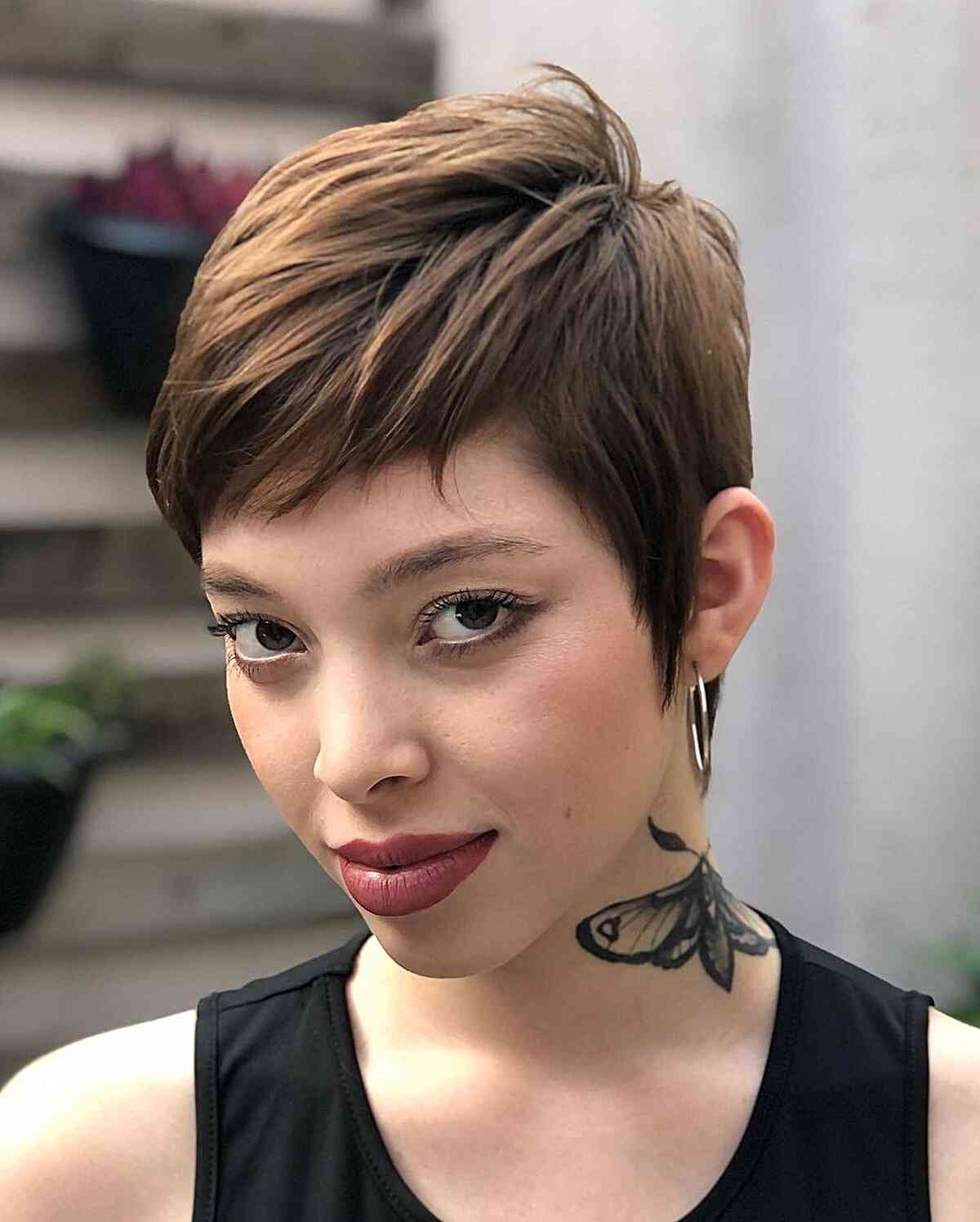 Low-Maintenance Cute Pixie Cut with a Subtle Side Part and Fringe