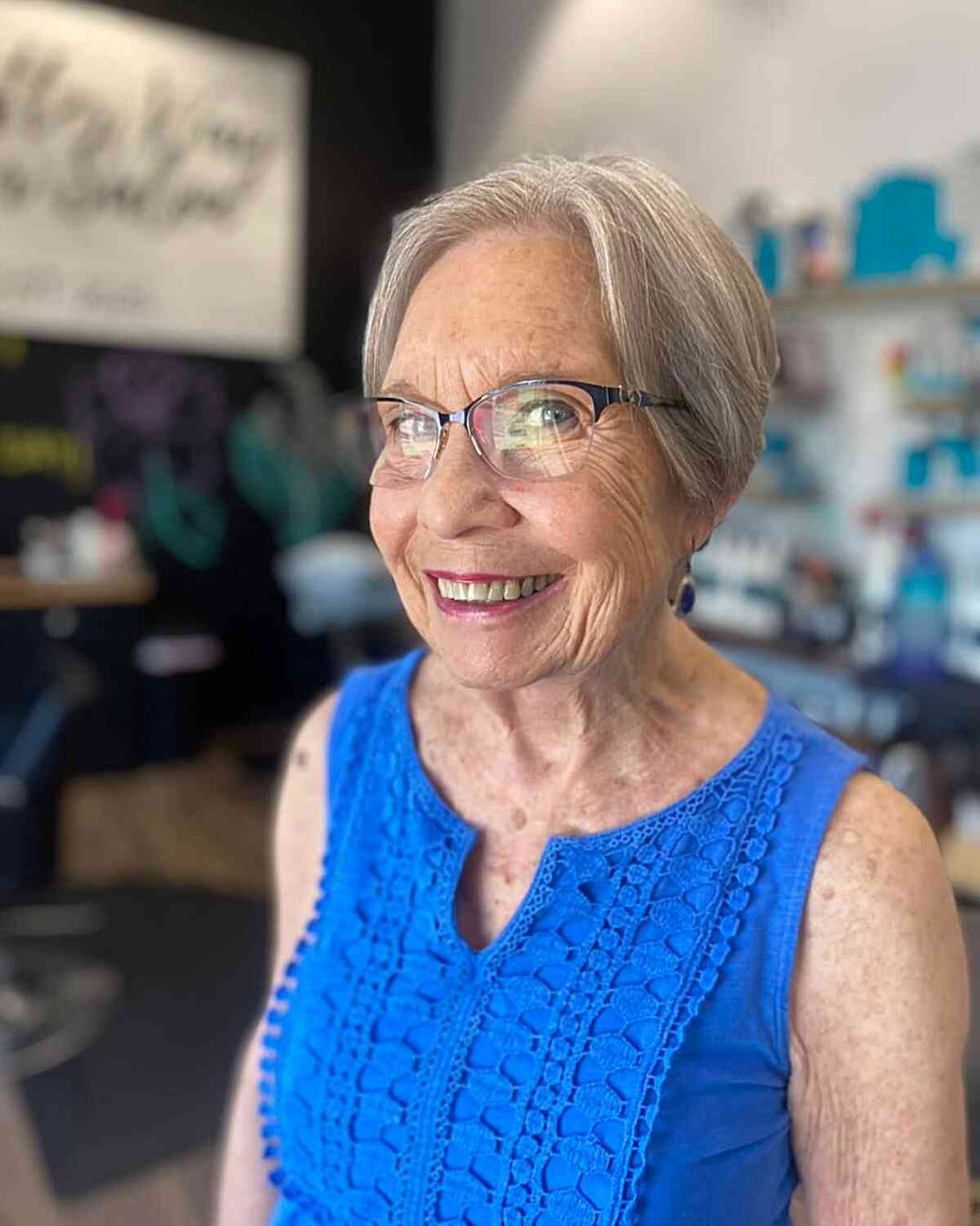 Face-Framing Silver Pixie for Seniors Over 60 with a pair of glasses