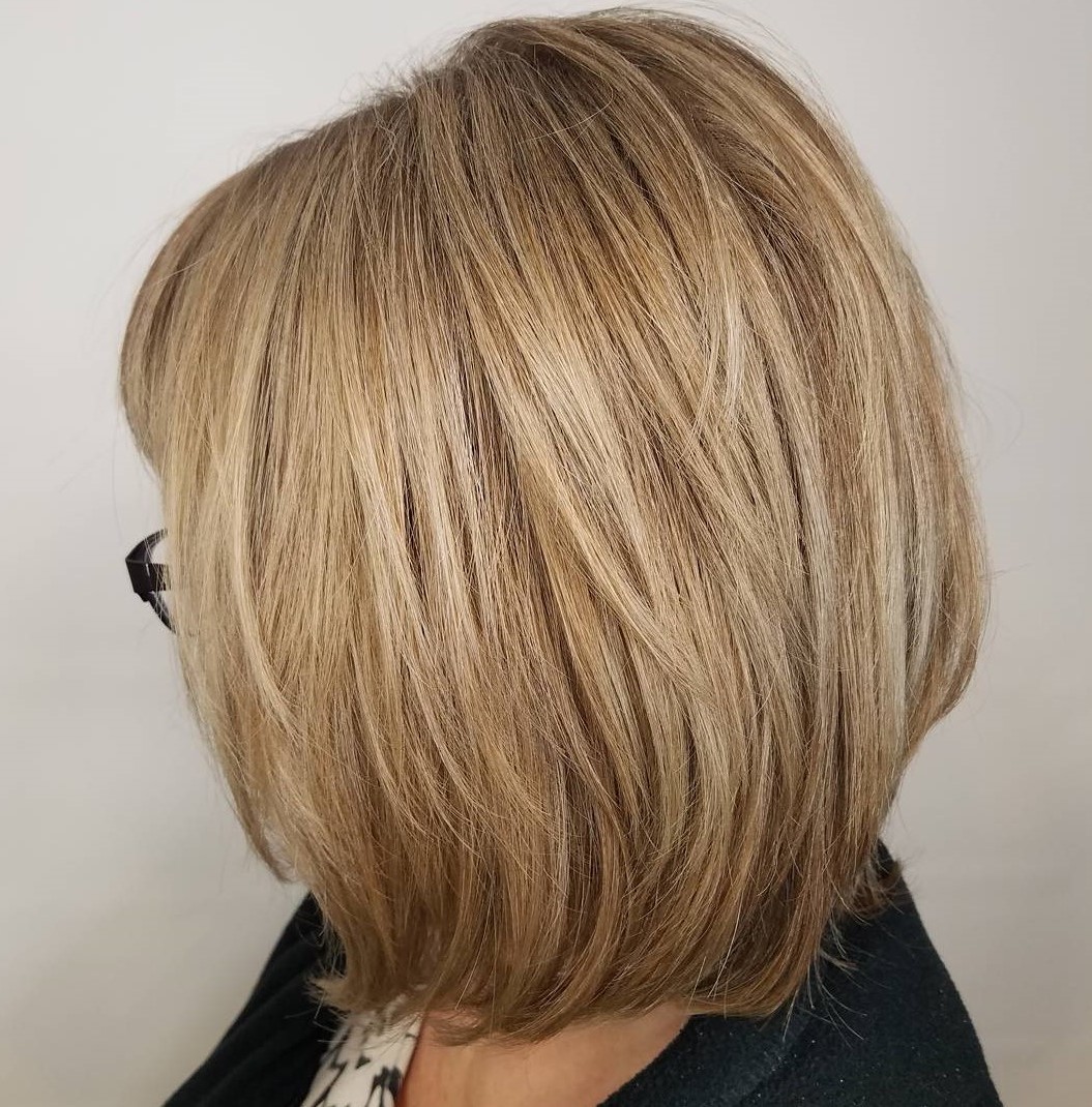 Over 60 Blonde Layered Bob with Bangs and Glasses