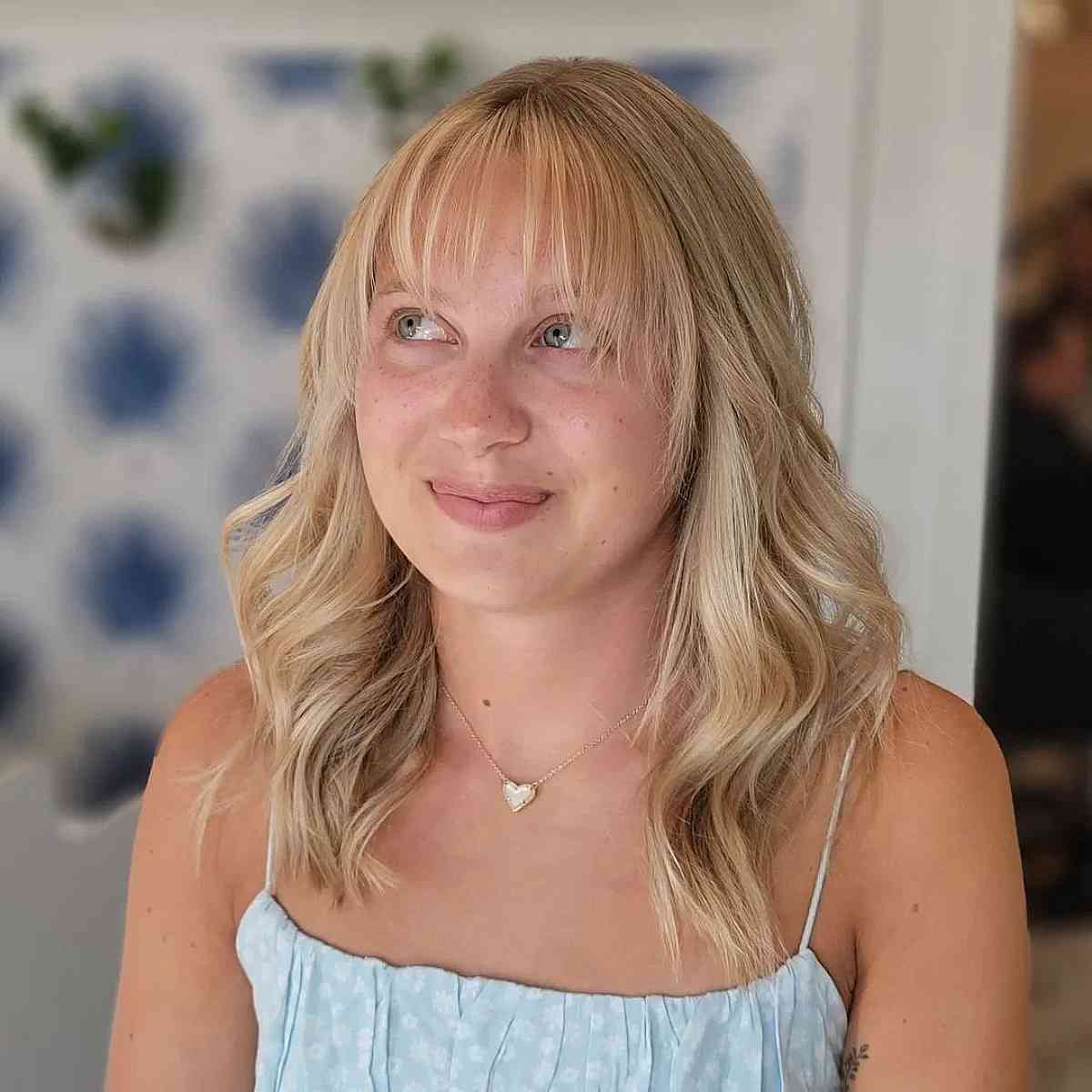 Blonde Layered Medium Hair with Soft, Wispy See-Through Bangs