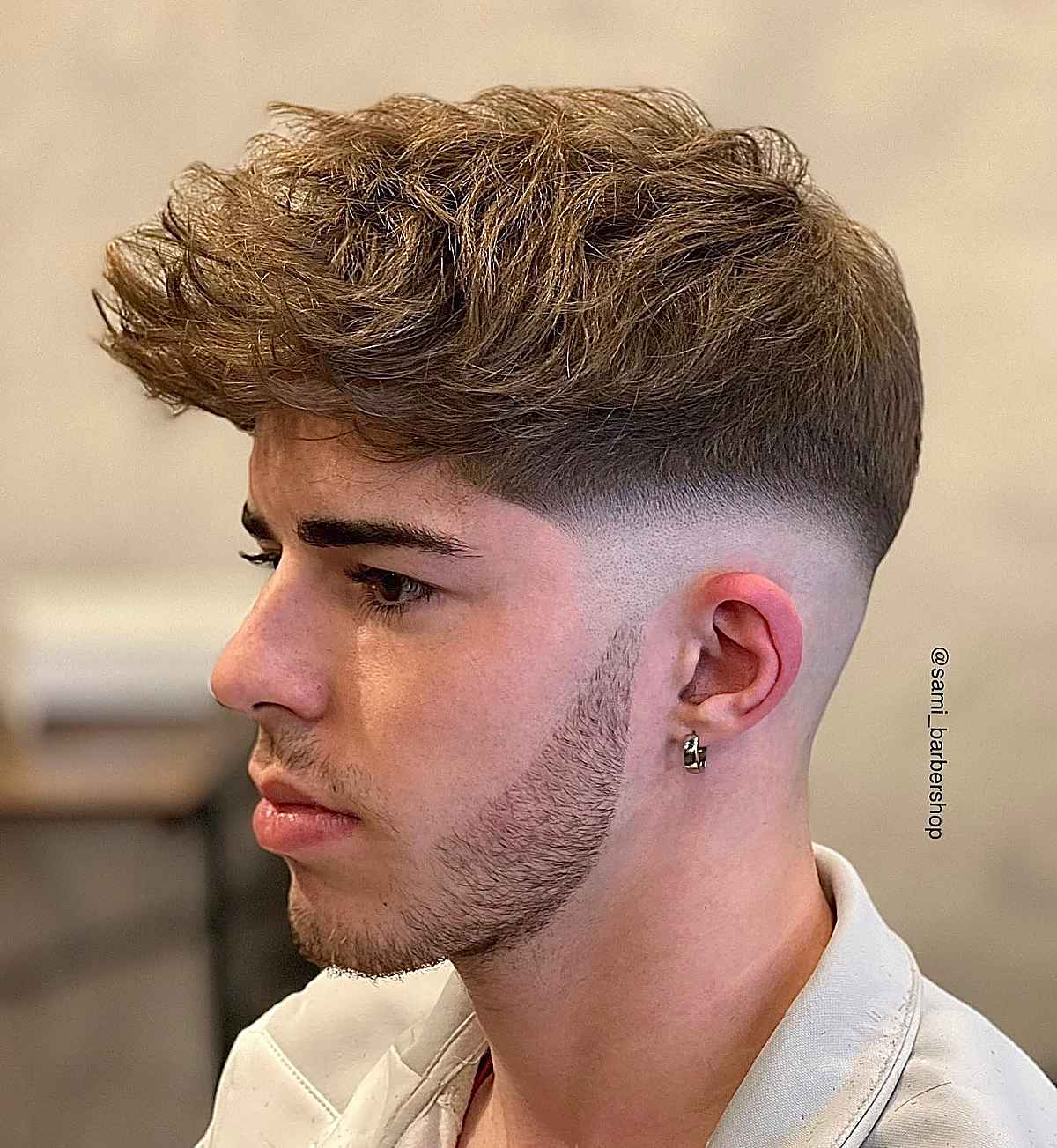 the mid drop fade on wavy short hair