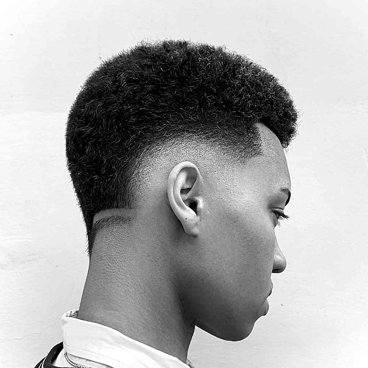 Sharp Mid Fade for Kinky Hair for Black Men with short hair