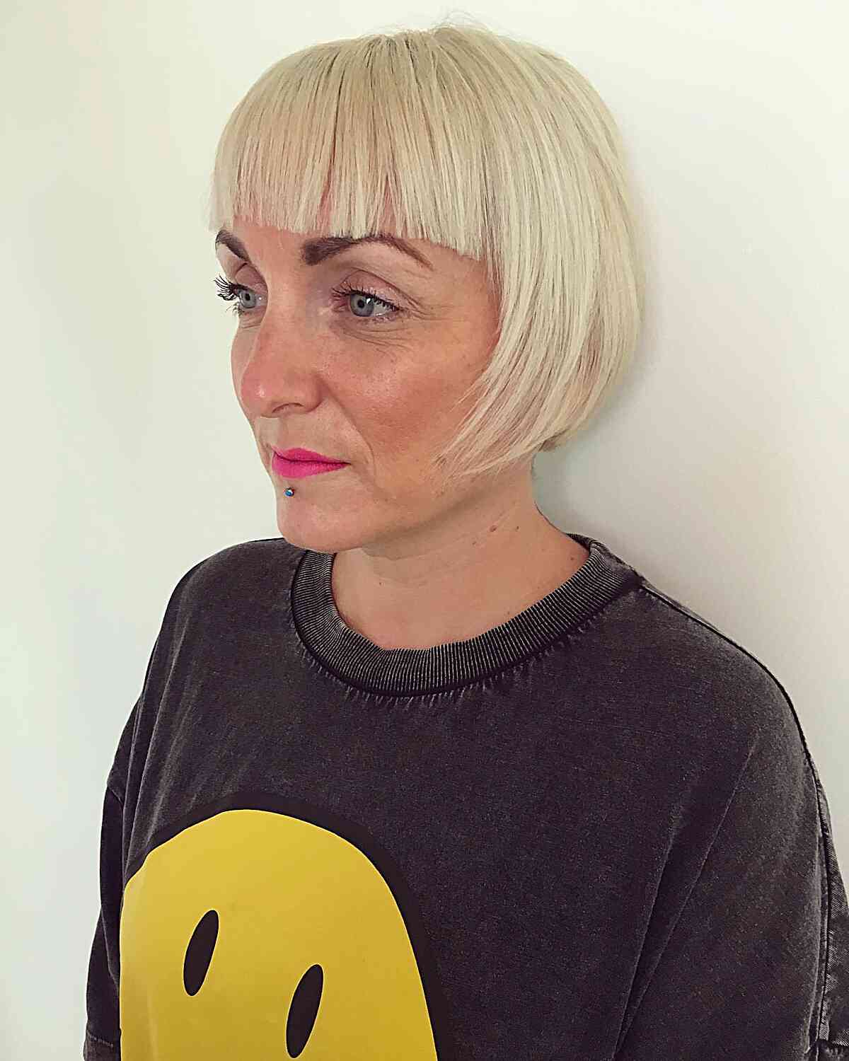 Short-Medium Cut with Brow-Skimming Bangs