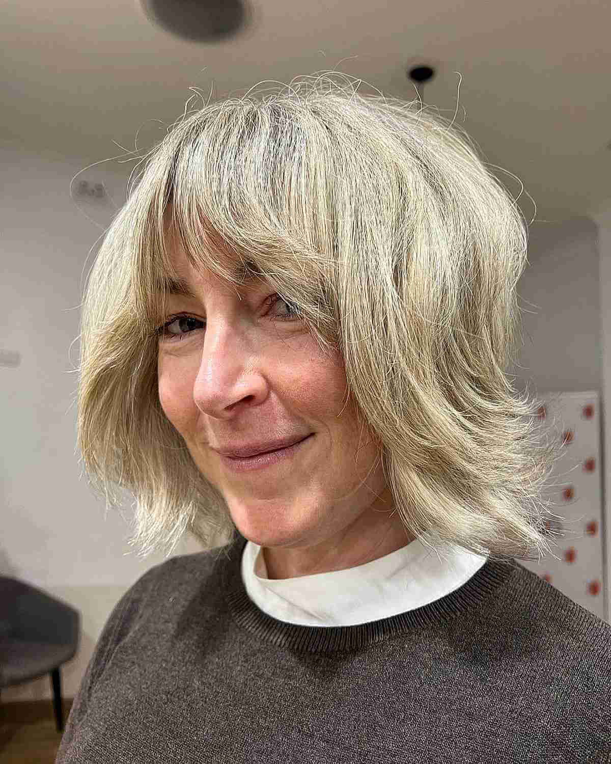 Short Fluffy Hair with Bangs for Women Over 50