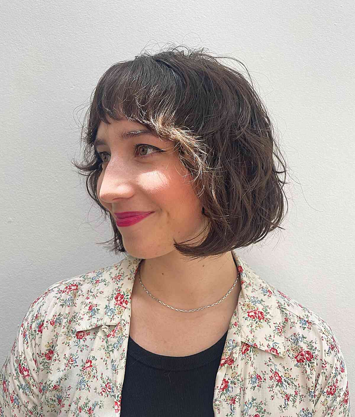 Chin-Grazing Layered Shaggy Bob with Short Bangs