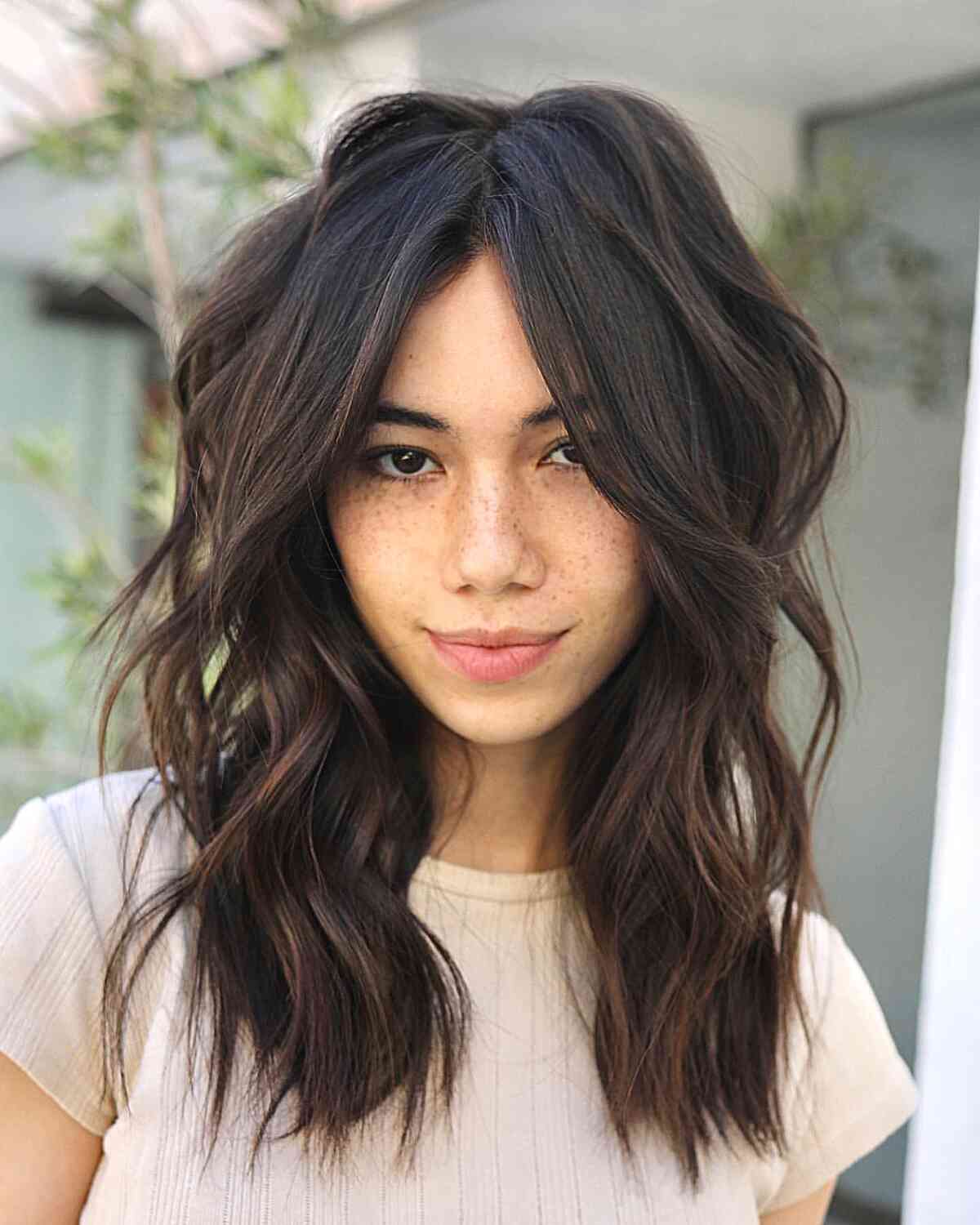 Medium Internal Layers and Face-Framing Long Bangs for women with thin hair