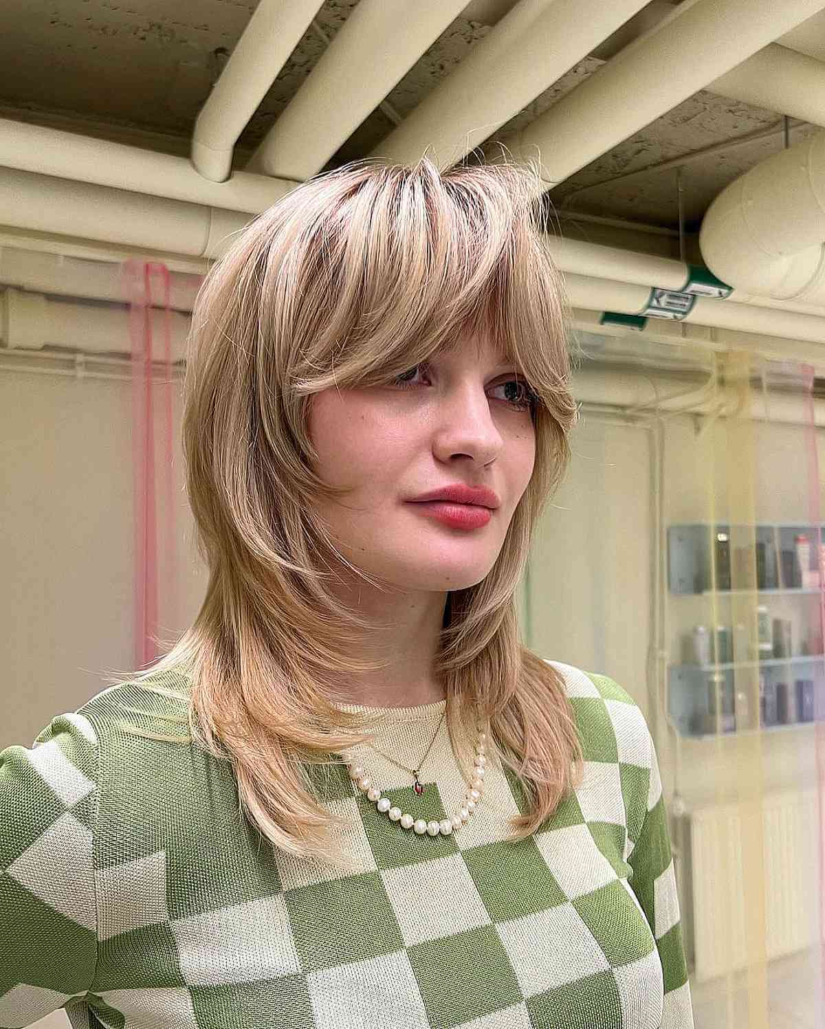 Face-Framing Bangs on a Mid-Length Layered Cut