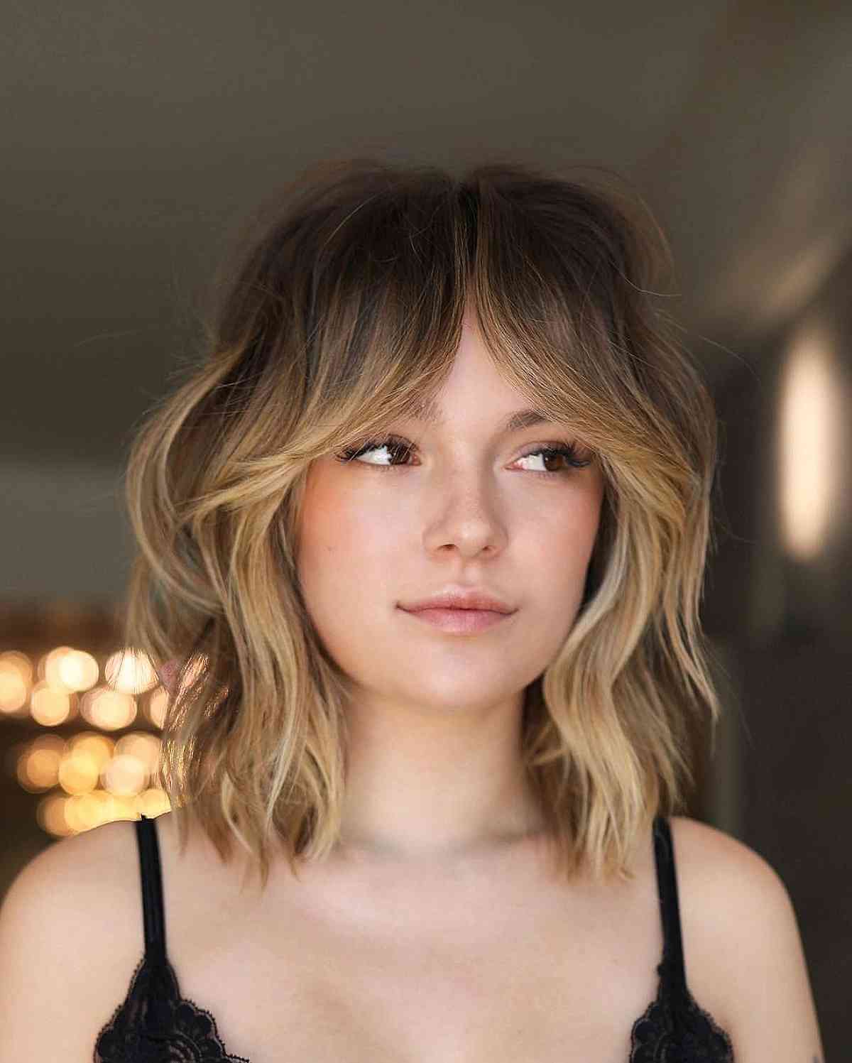 Shoulder-Length Hair with Face-Framing Curtain Bangs