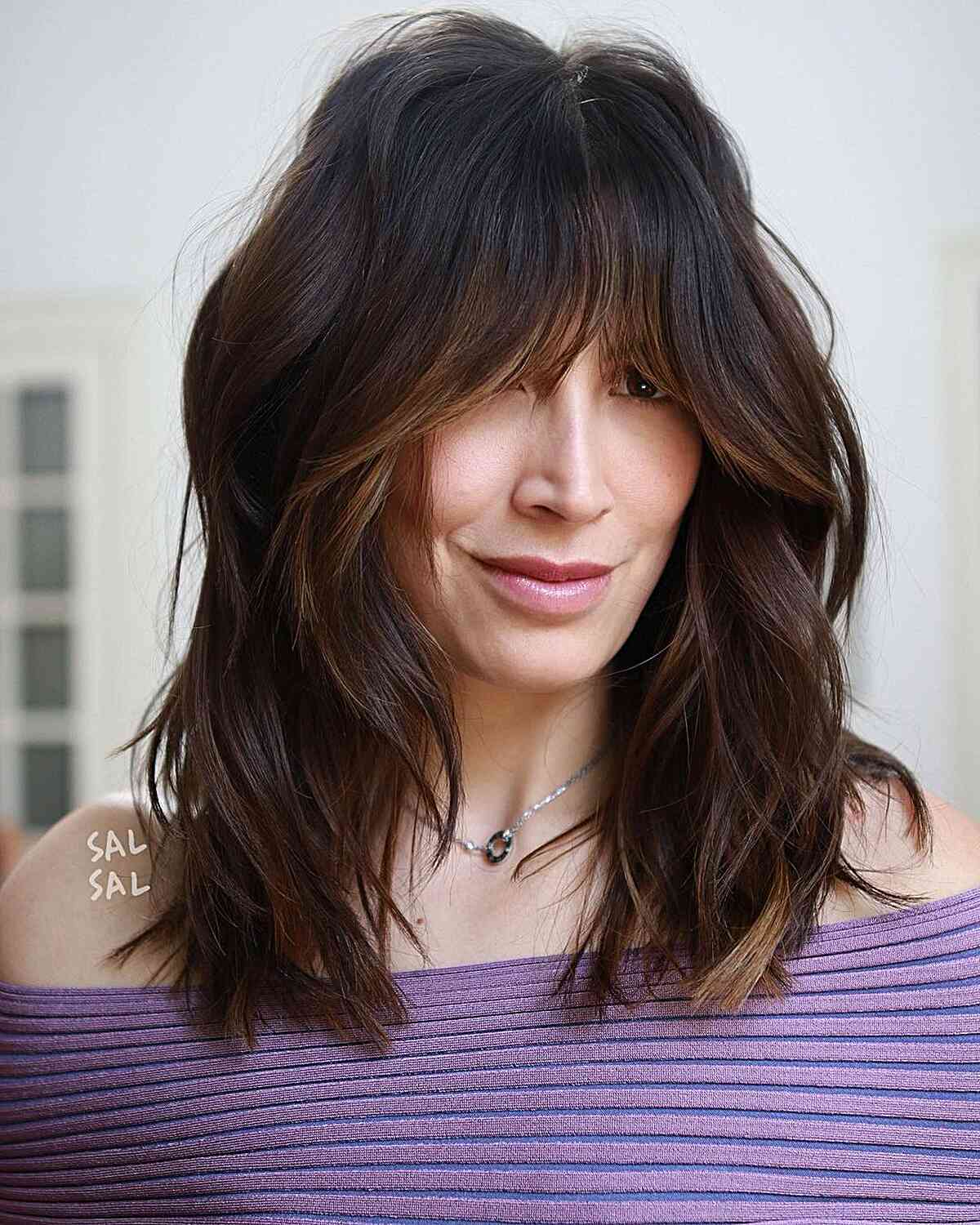 Face-Framing French Bangs for Mid-Length textured hair