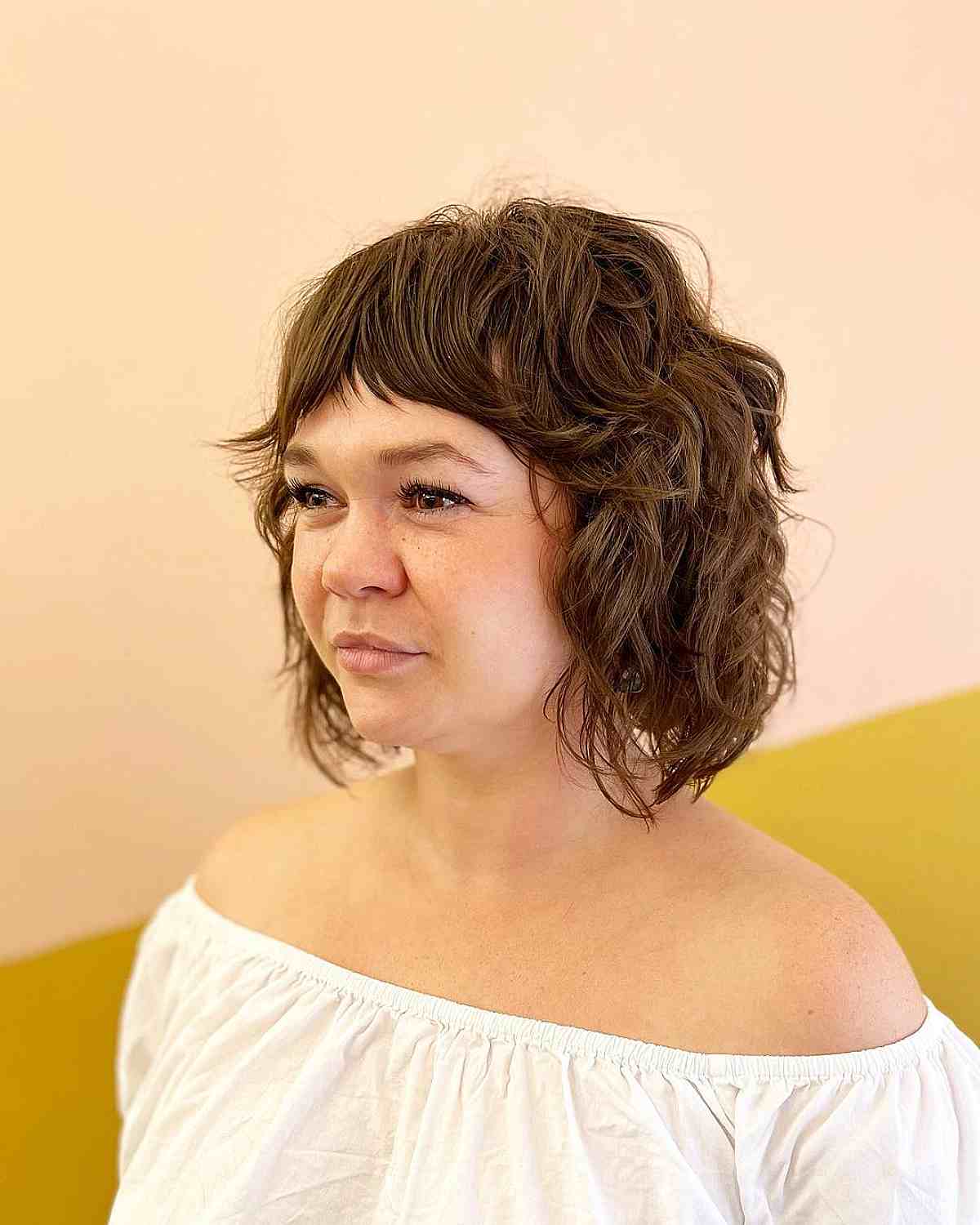 Curly Shaggy Bob with Short Curtain Bangs