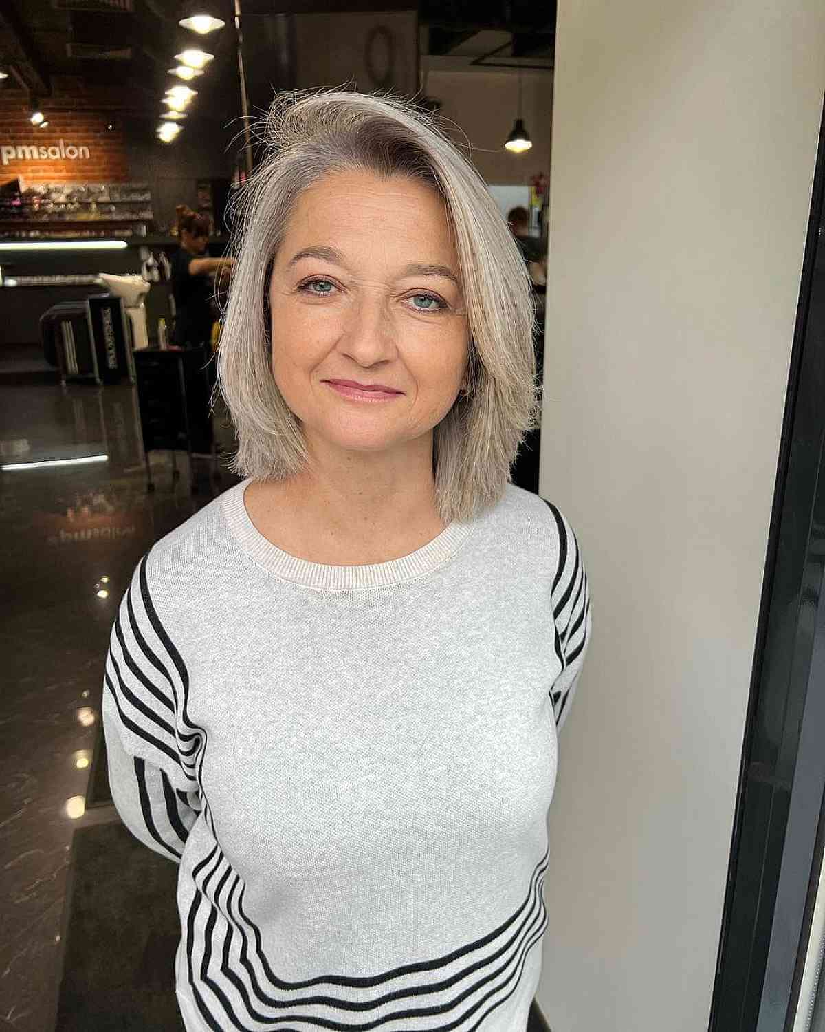 Gray Layered Bob with a Side Part for 50-Year-Olds