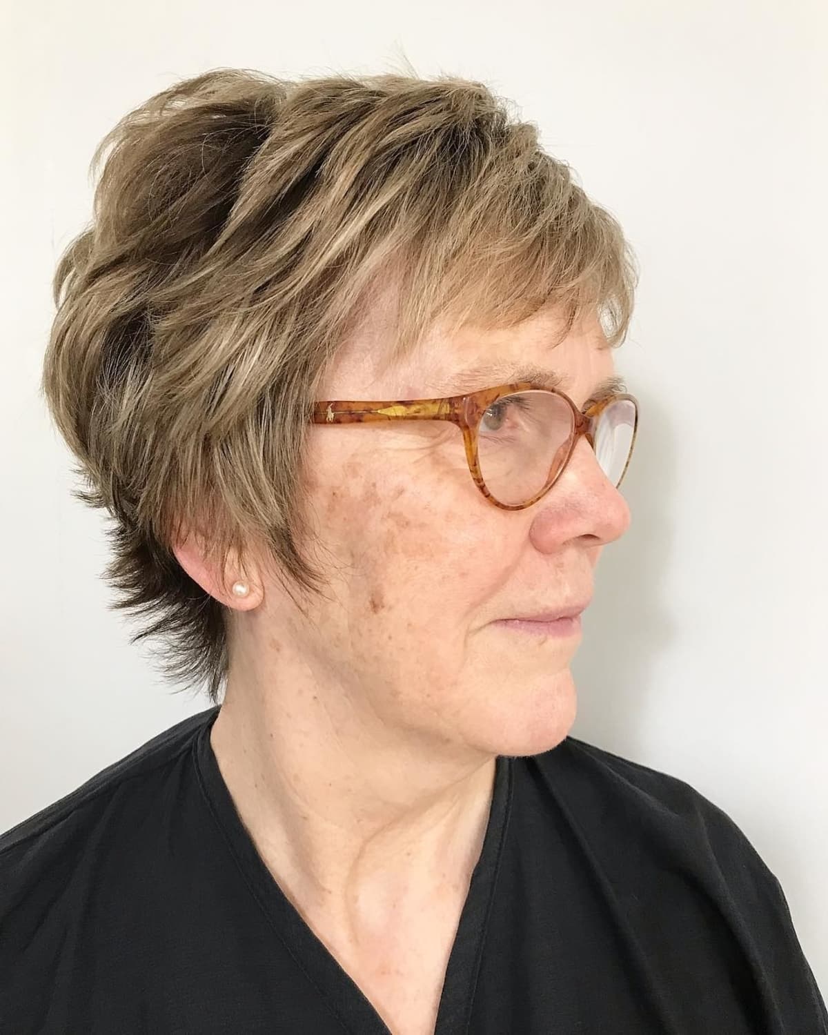 Pixie hairstyle for women over 70 with glasses