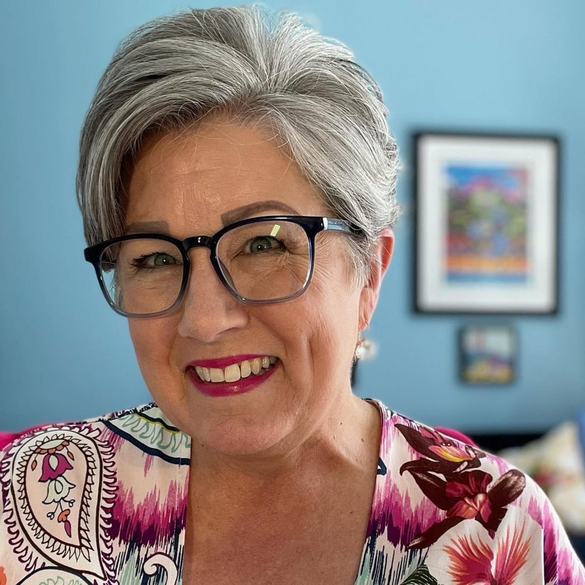 Long pixie cut on an older woman with glasses