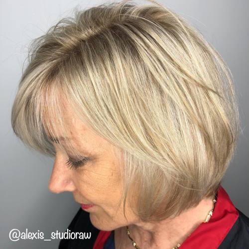 Layered Wheat Blonde Bob With Bangs