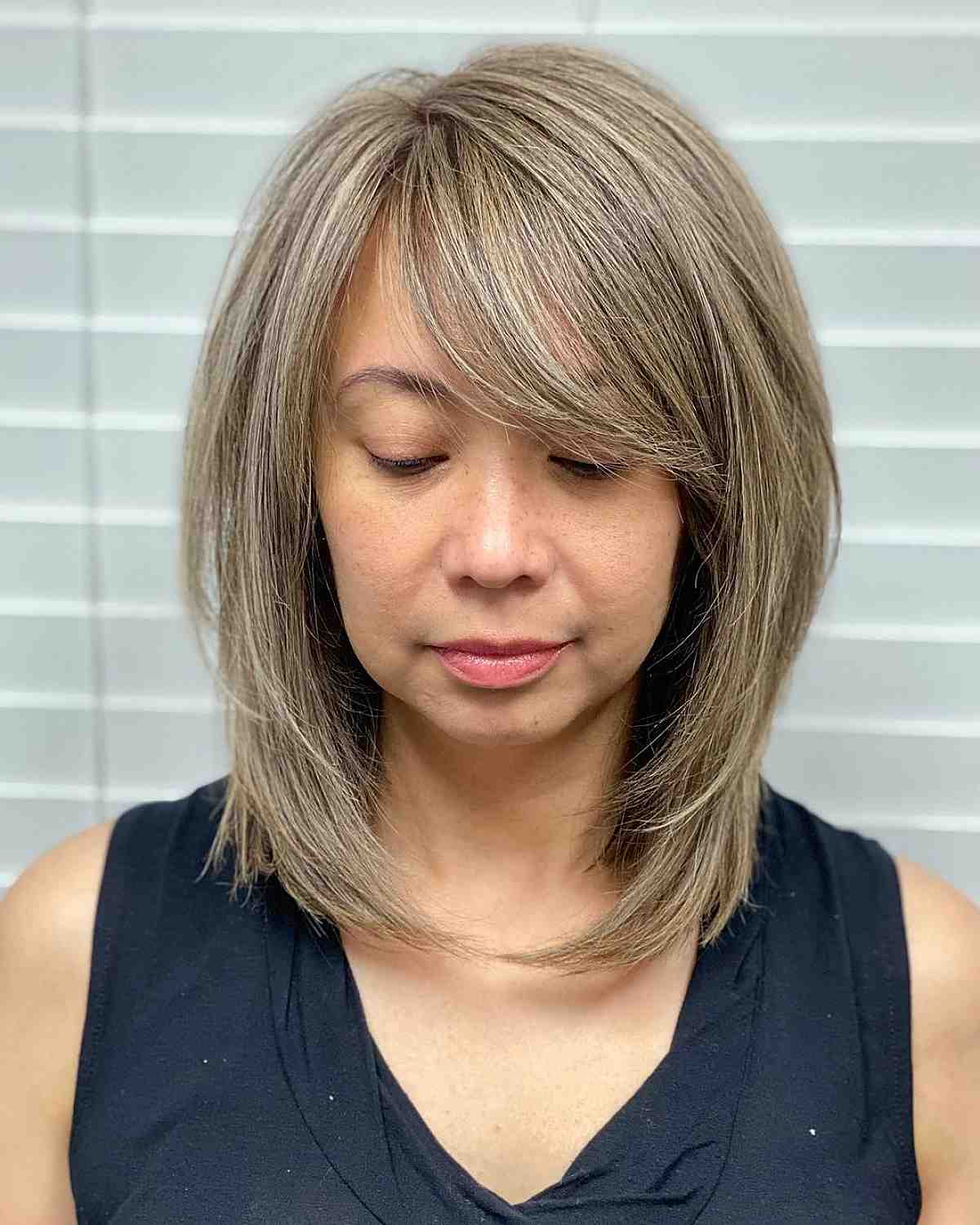 lob with side bangs for ladies with round faces