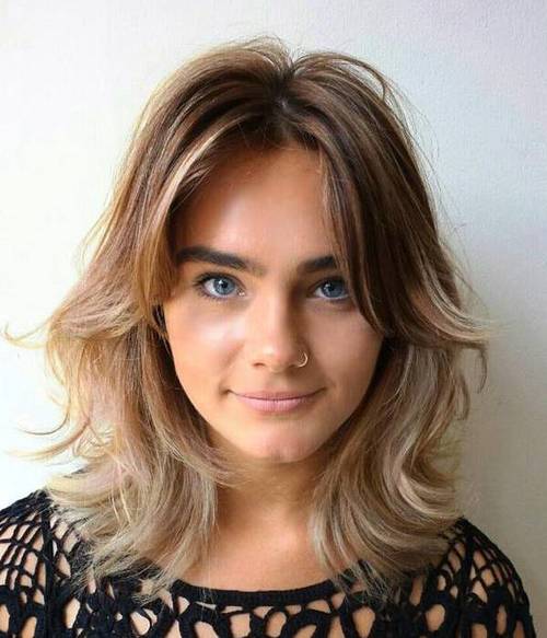 Medium Length Shaggy Hairstyle with Curtain Bangs