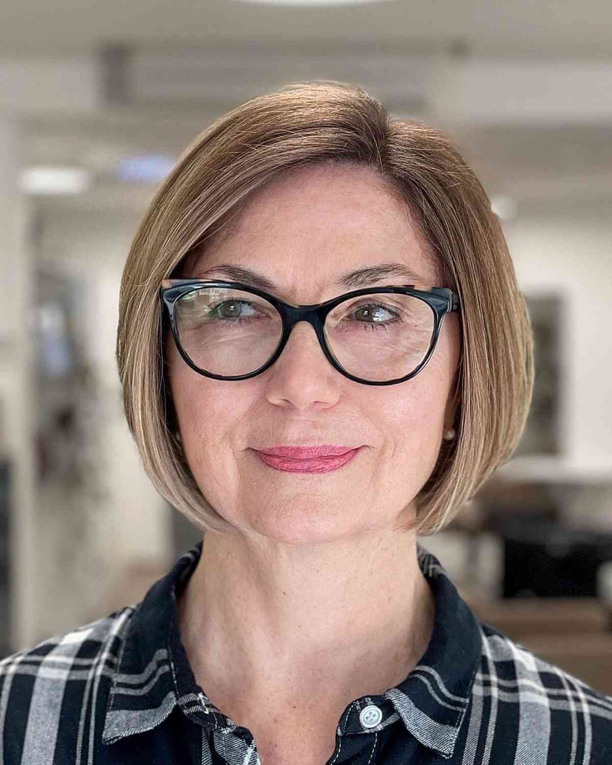 Elegant Side-Part Chin-length Bob for 50-Year-Old Ladies