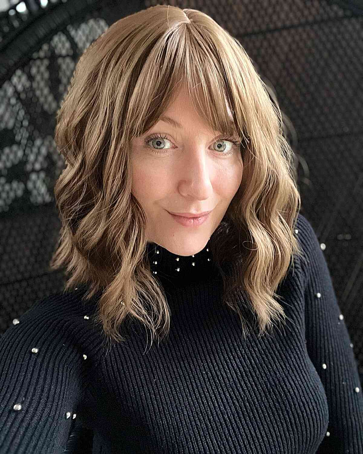 Medium hairstyle with angled bangs and long layers