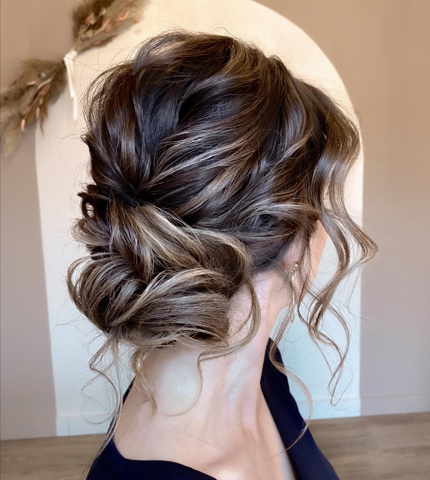 Loose Wavy Chignon Updo for Long Hair