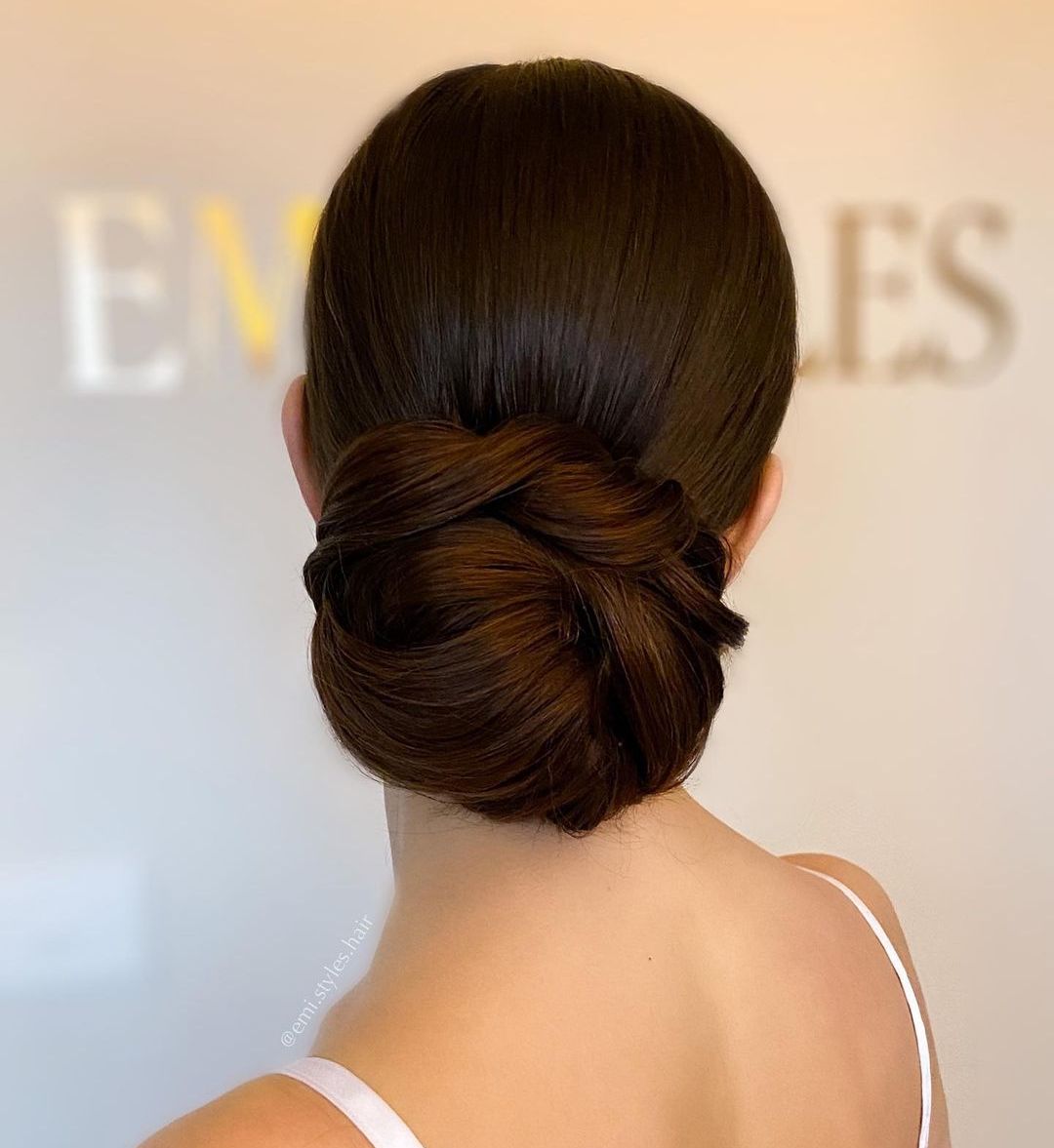 Sleek Low Bun Hairstyle with a Twist