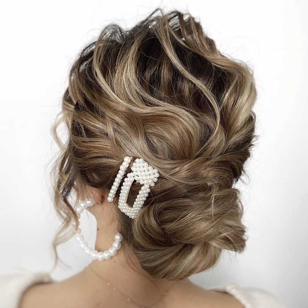 Messy Low Curly Bun Updo