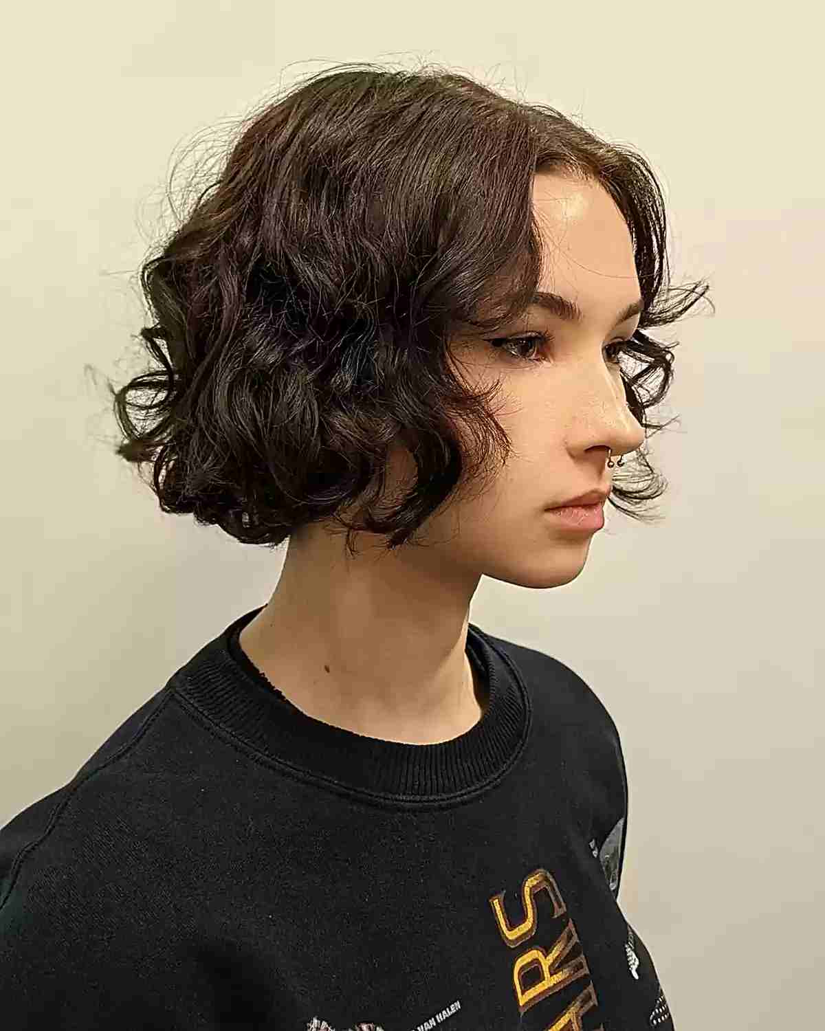 Face-Framing Short Layered Bob with Loose Curls