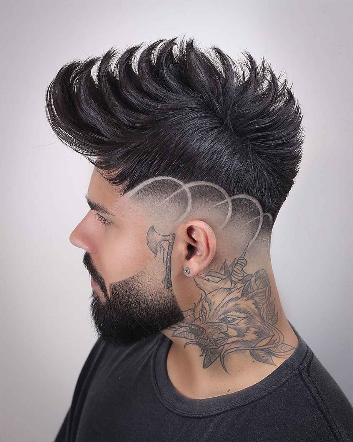 medium spiked fade on a faux hawk haircut