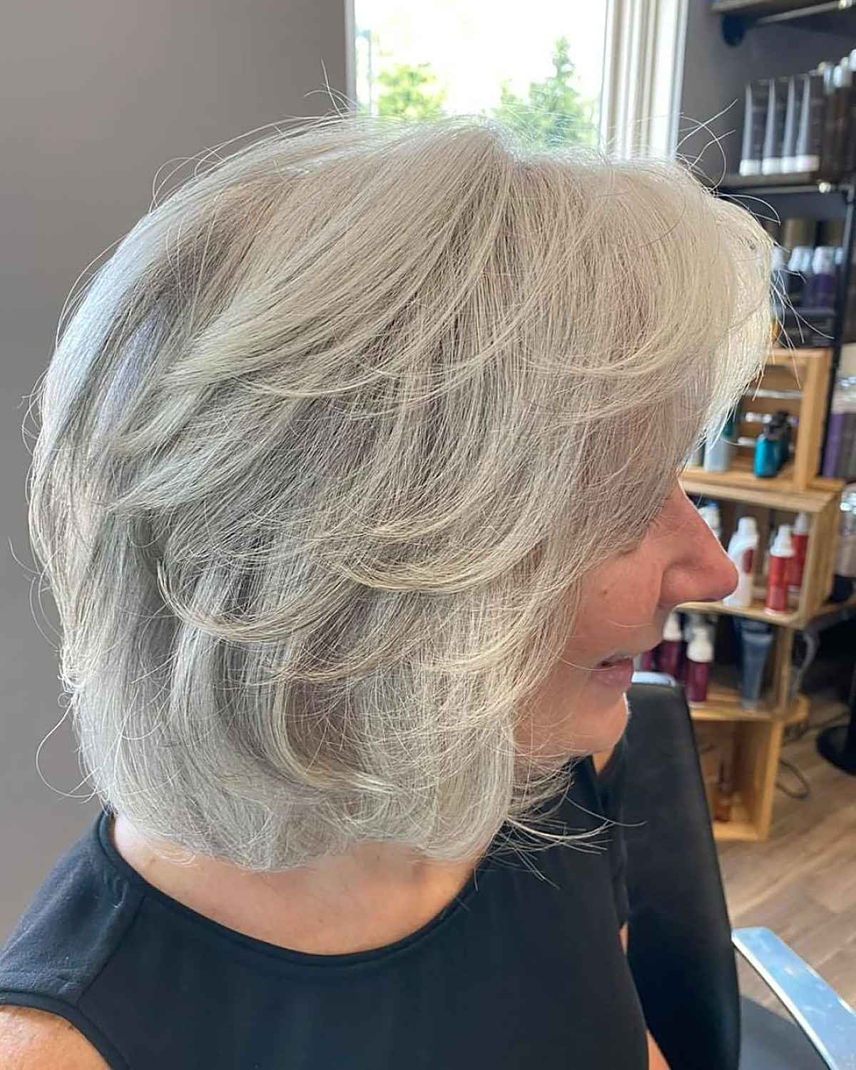 Chic short bob with side-swept bangs for women over 60