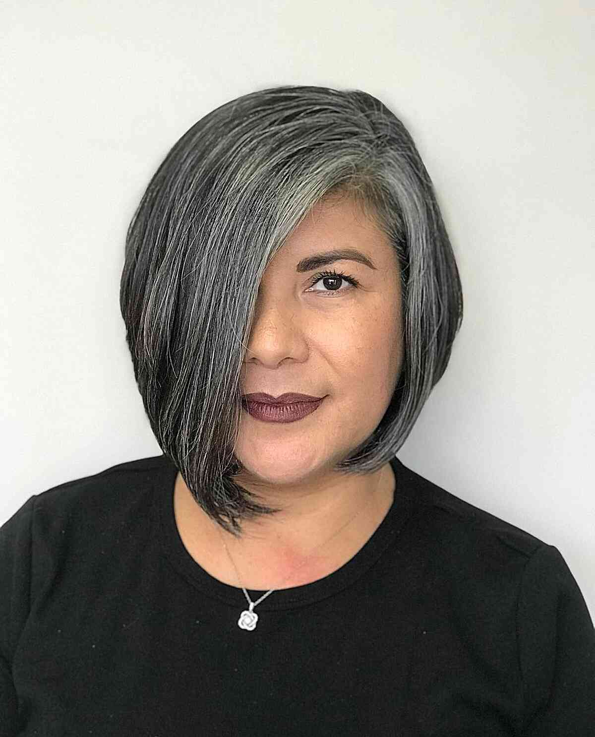 Short Asymmetrical Bob with Side-Swept Bangs for Women